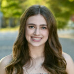 a woman smiling at camera