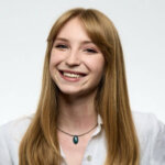 a woman smiling at camera